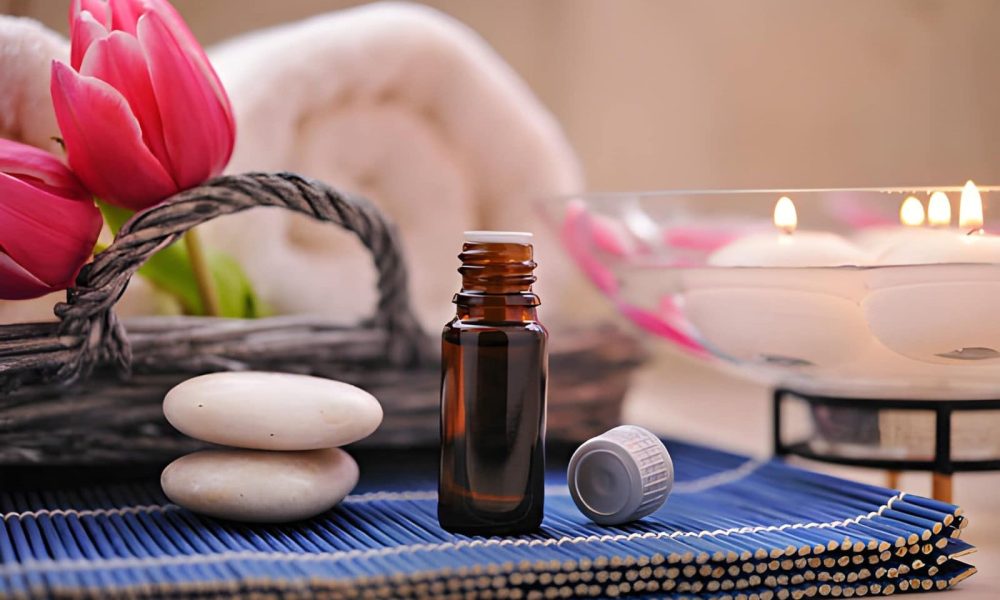 Aromatherapy St Petersburg FL spa scene with essential oil bottle, tulips, towels, and floating candles.