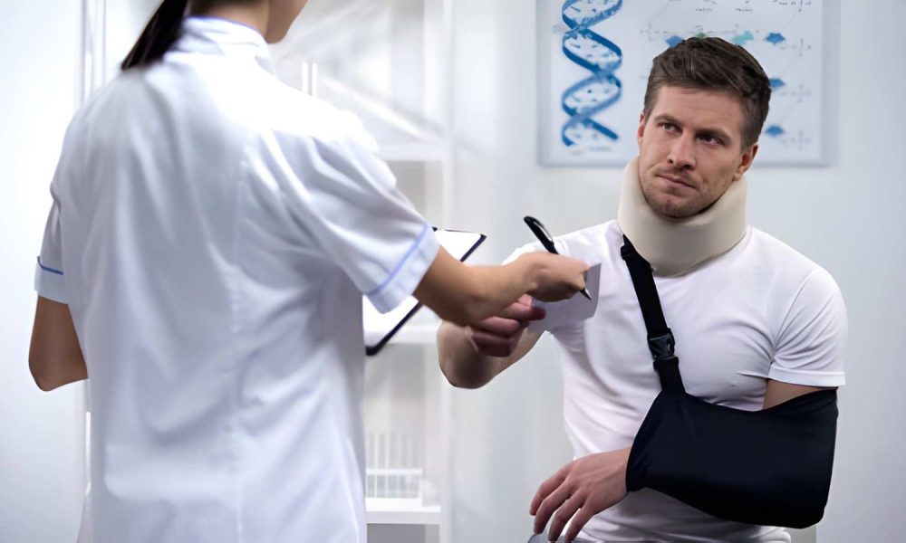 Patient with neck brace and arm sling consulting auto accident chiropractor in St Petersburg FL