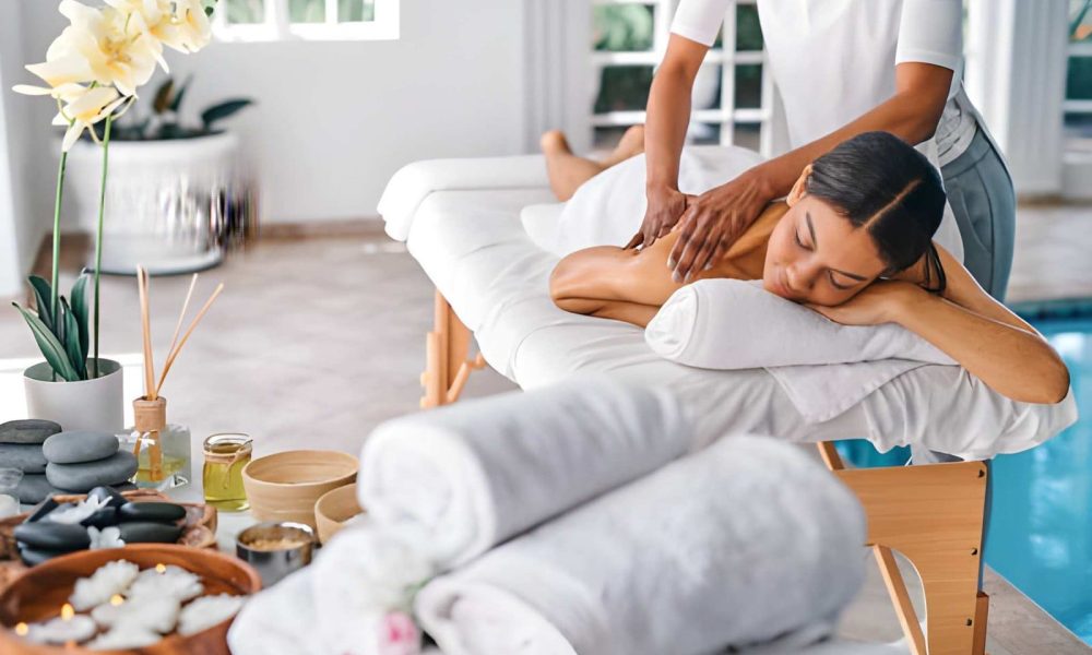 Full body massage St Petersburg FL therapist providing relaxing spa treatment with oils, stones, and candles.