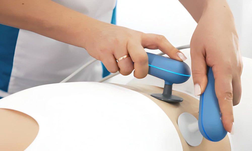 Softwave tissue regeneration therapy near me—clinician using handheld device on patient simulator.